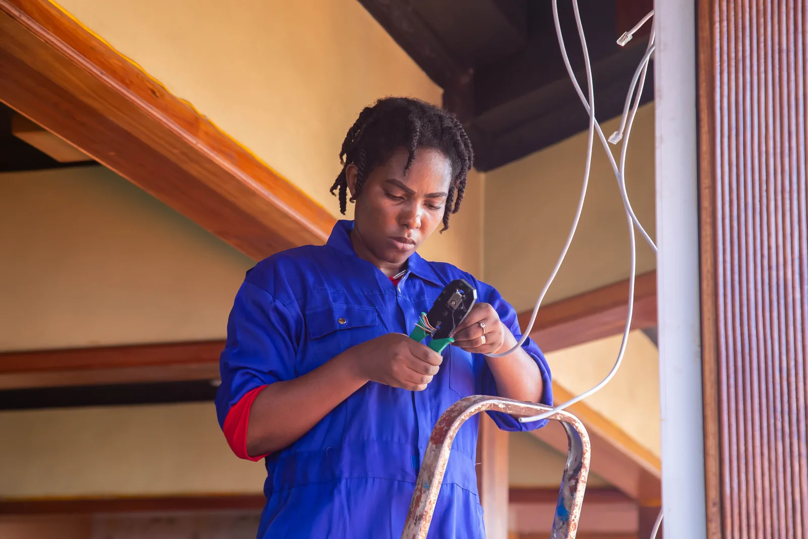 Terminating a cable from a step ladder, for code violation in Detroit