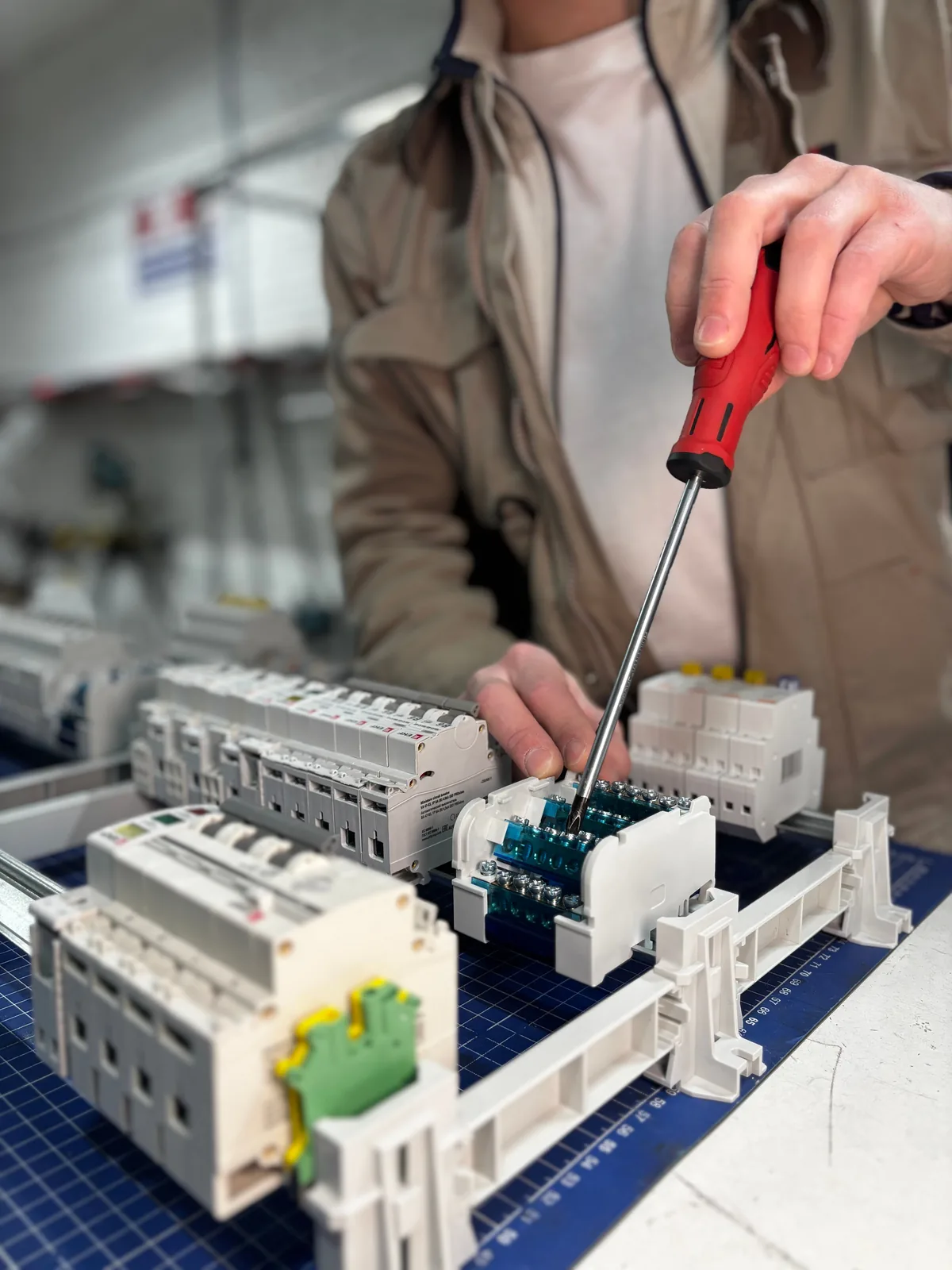 Breakers assembled on a DIN rail before installation, for ev charger installation in Detroit