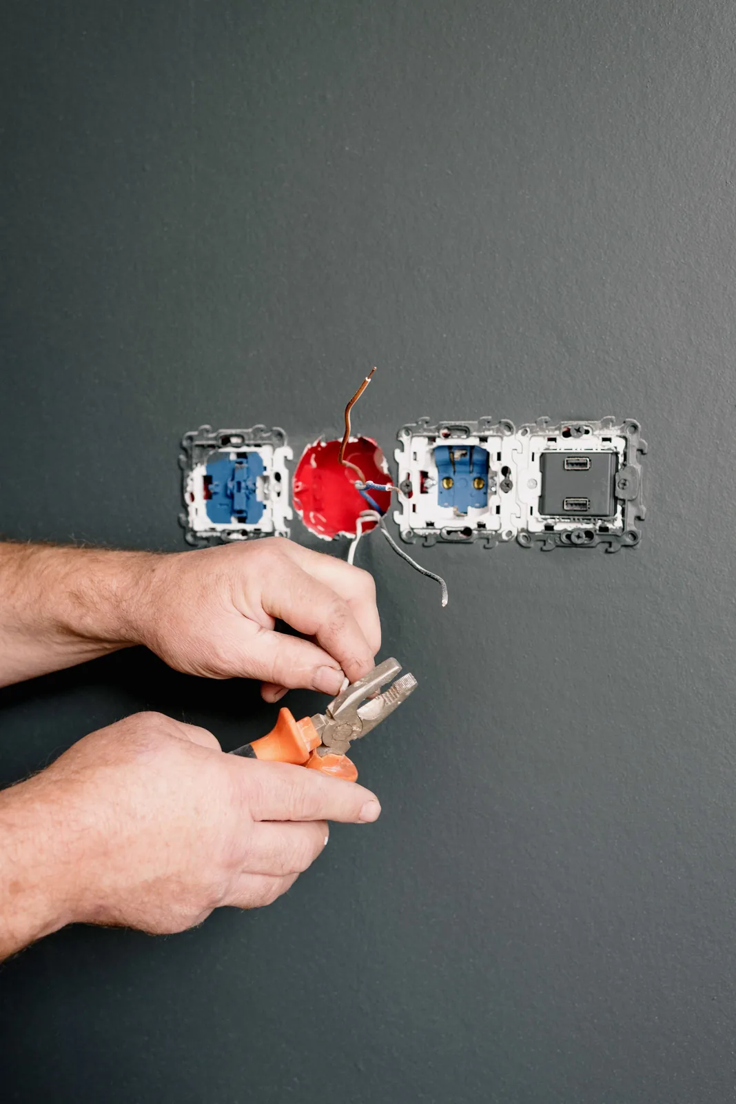 Wiring an outlet box into a finished wall, for code violation in Detroit